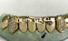 gold grillz with diamond fangs
